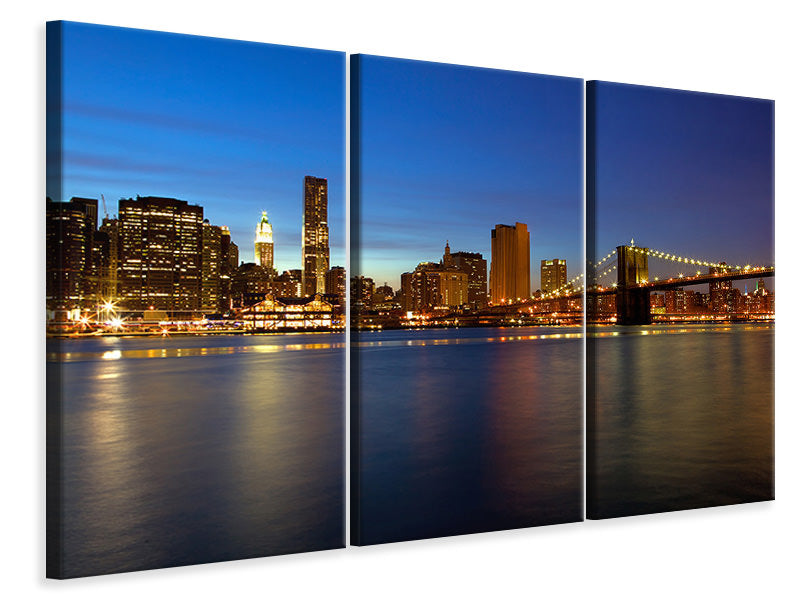 Leinwandbild 3-teilig Skyline Manhattan im Lichtermeer