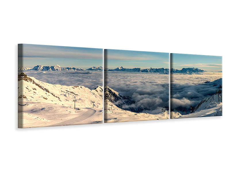 Panorama Leinwandbild 3-teilig Über den Wolken im Schnee