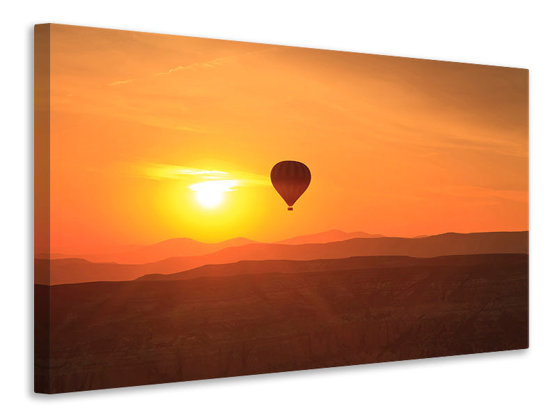 Leinwandbild Heissluftballon bei Sonnenuntergang