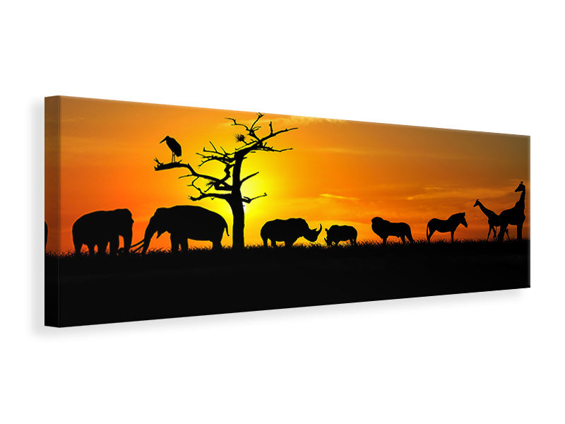 Leinwandbild Panorama Safarietiere bei Sonnenuntergang